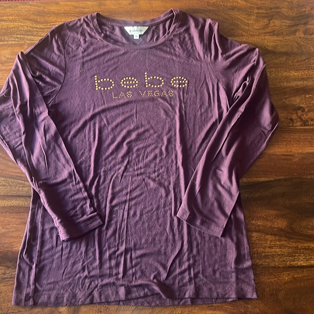 Long sleeves purple never top with shiny gold beads . Nice fit